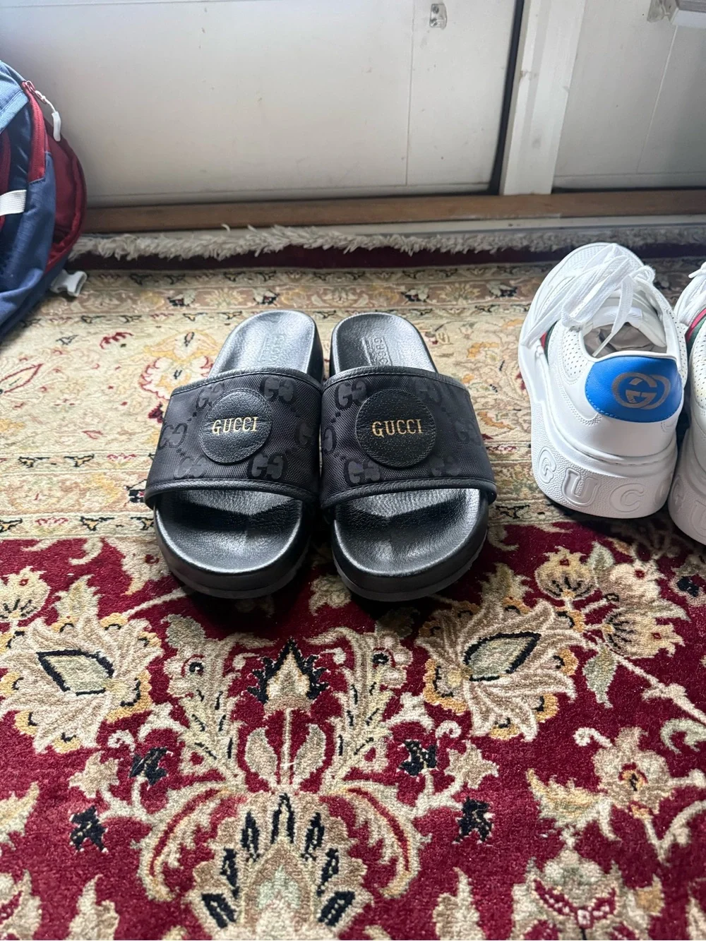 Gucci Black GG Monogram Slide Sandals with Gold Logo